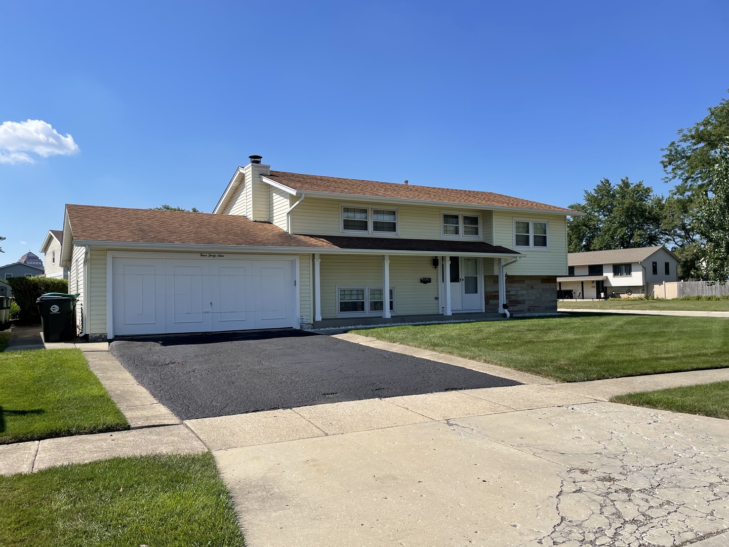 449 Yarmouth Road Elk Grove Village, IL 60007 - Photo 2 of 48 a front view of a house with a yard