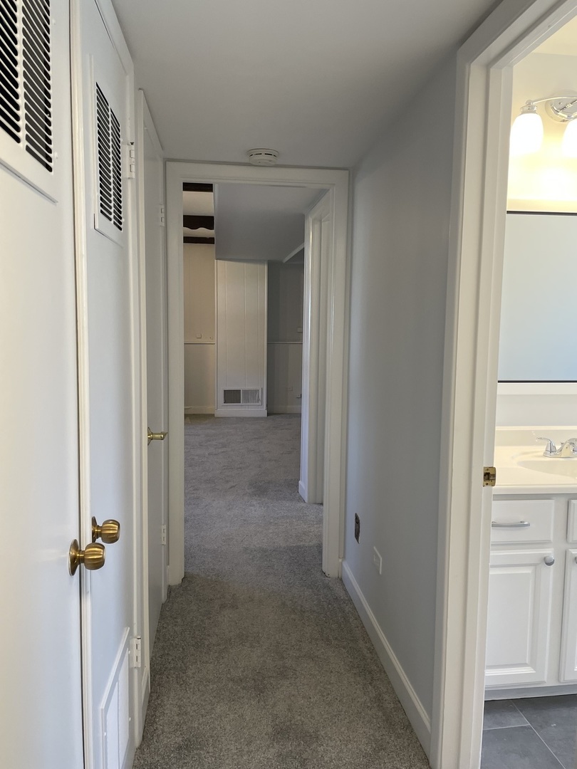 449 Yarmouth Road Elk Grove Village, IL 60007 - Photo 31 of 48 a view of a hallway with closet and a window