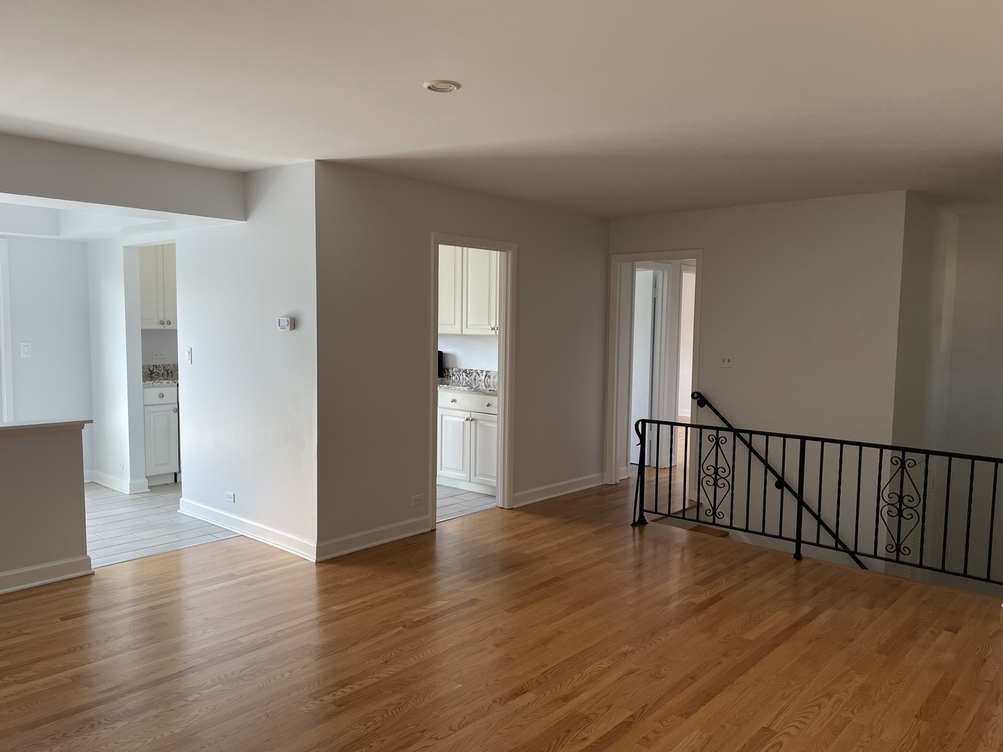 449 Yarmouth Road Elk Grove Village, IL 60007 - Photo 5 of 48 a view of an empty room with wooden floor