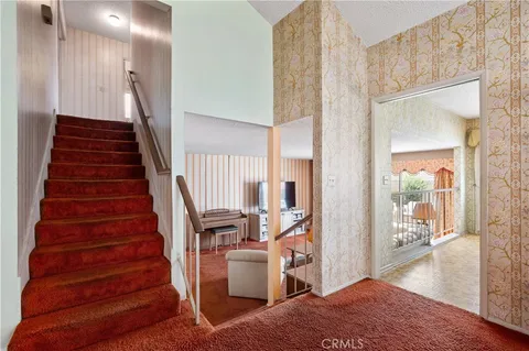 a very nice looking dining room with a table and chairs
