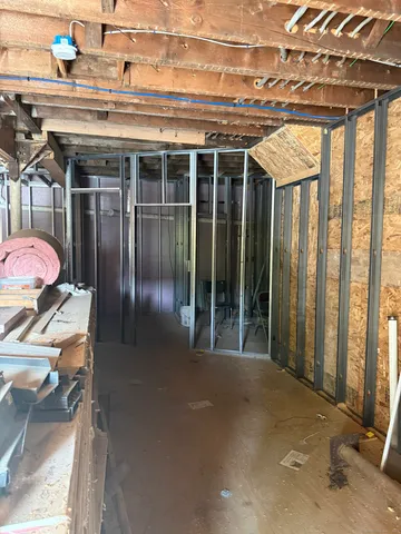 a view of a porch with a table and chairs