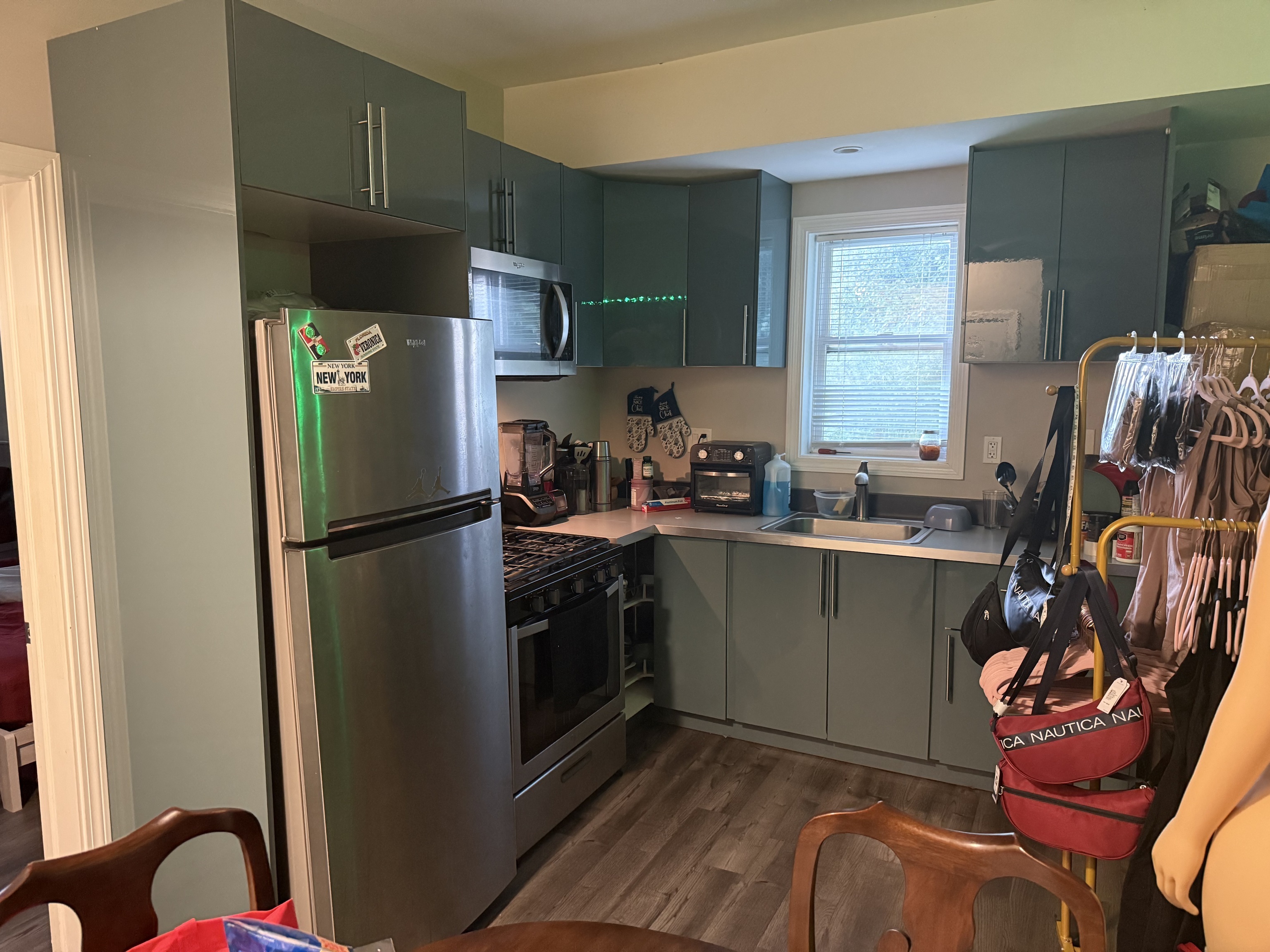 210 Bishop Street Waterbury, CT 06704 - Photo 8 of 9 a kitchen with stainless steel appliances granite countertop a refrigerator sink and stove