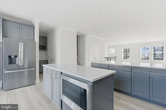 a kitchen with a sink cabinets and stainless steel appliances