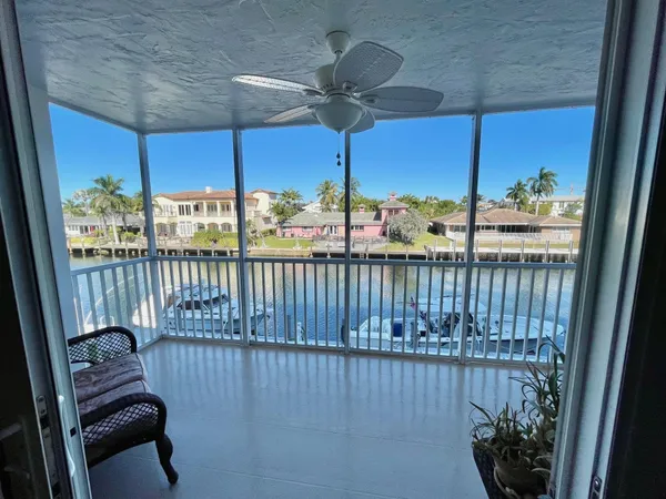 a view of a balcony with furniture