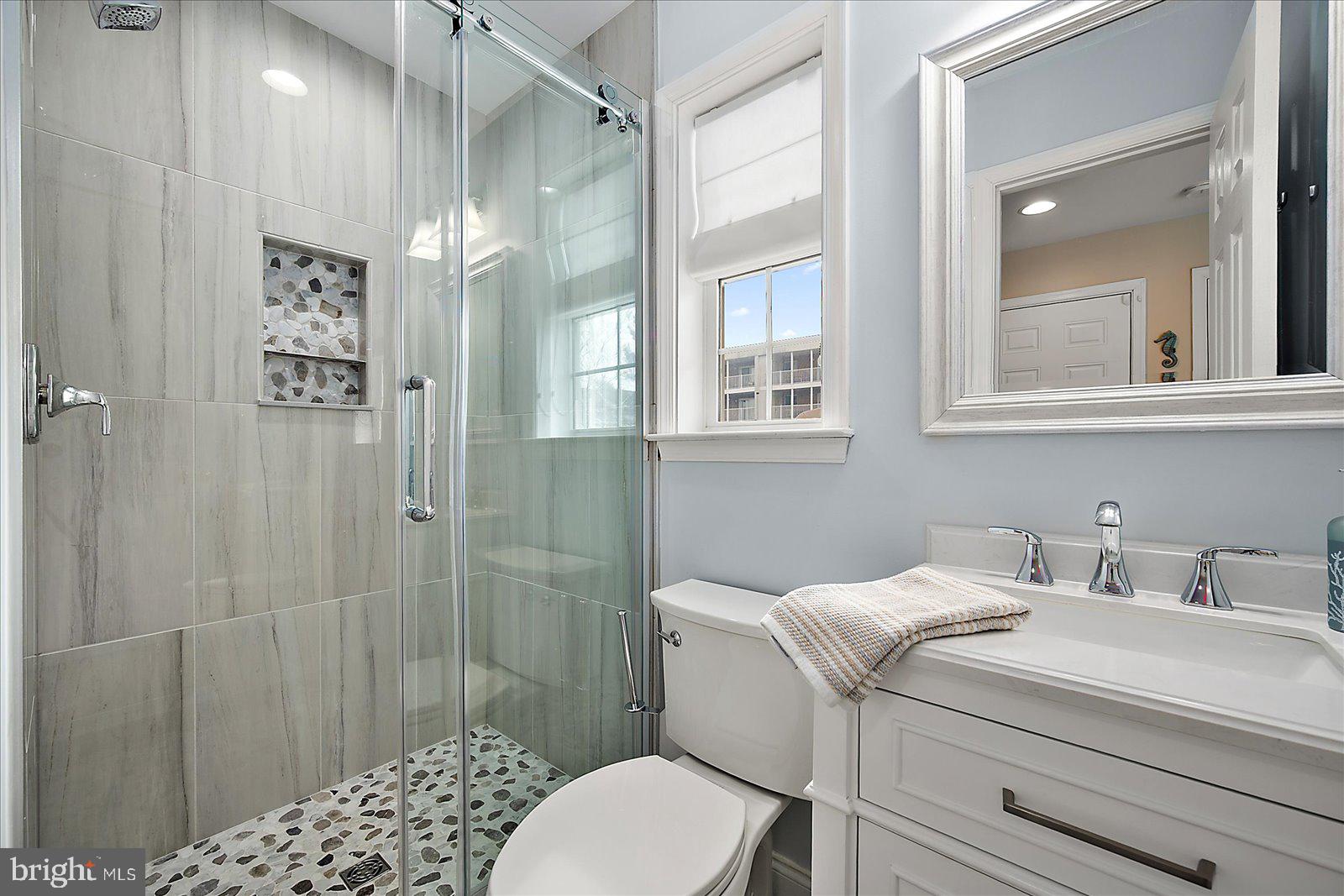 617 Salt Spray Road, Unit D Ocean City, MD 21842 - Photo 29 of 69 a bathroom with a sink toilet and shower