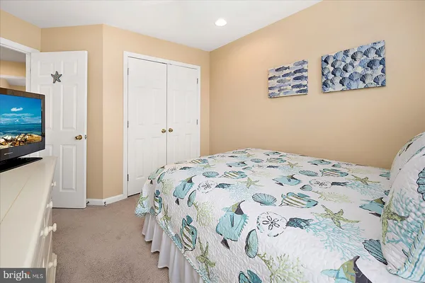 a view of a livingroom with furniture and floor to ceiling window
