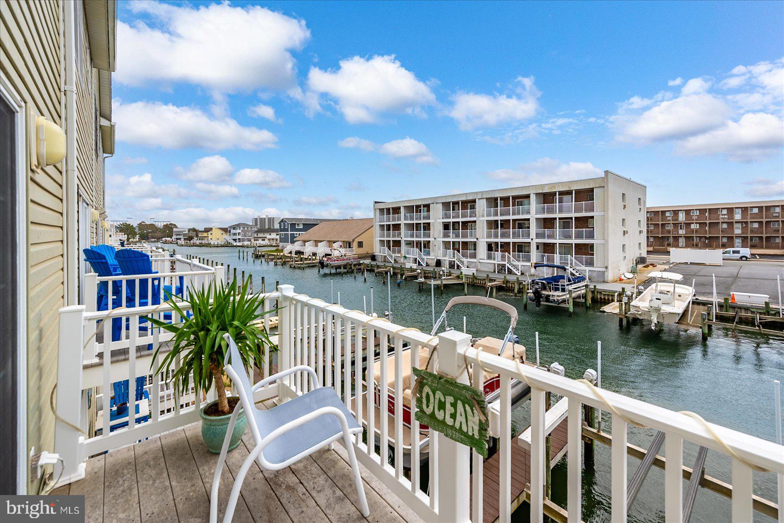 617 Salt Spray Road, Unit D Ocean City, MD 21842 - Photo 42 of 69 a view of a lake with a deck and city view