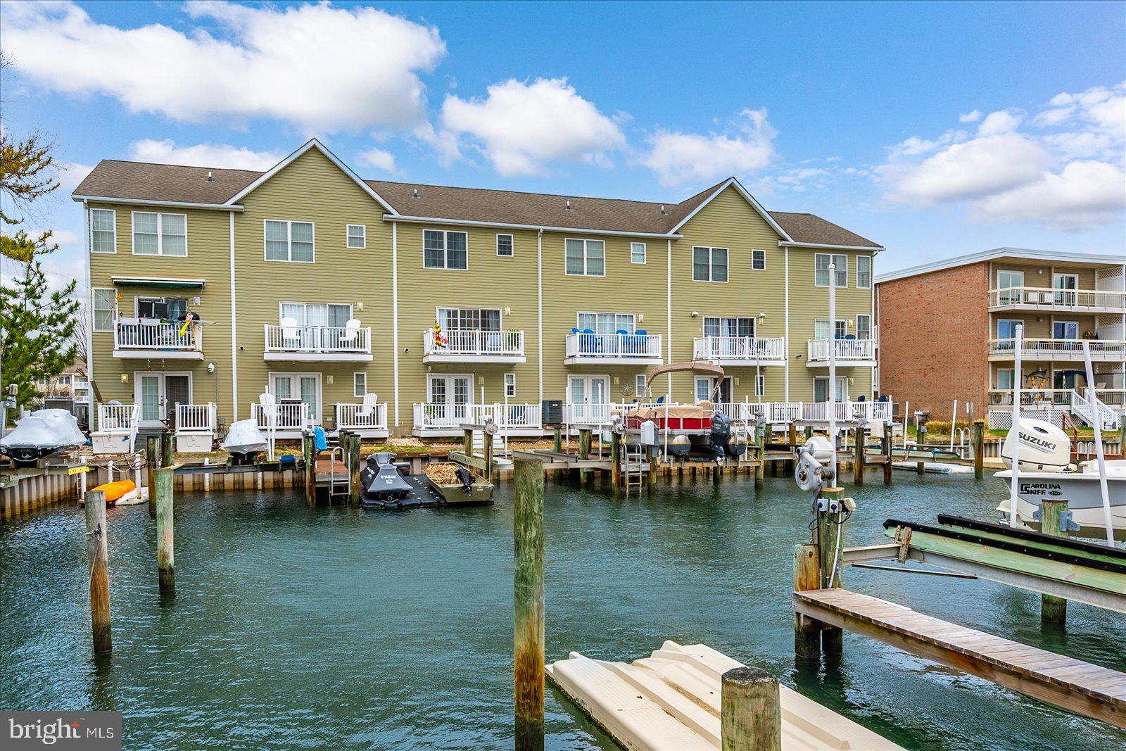617 Salt Spray Road, Unit D Ocean City, MD 21842 - Photo 48 of 69 a view of swimming pool with outdoor seating