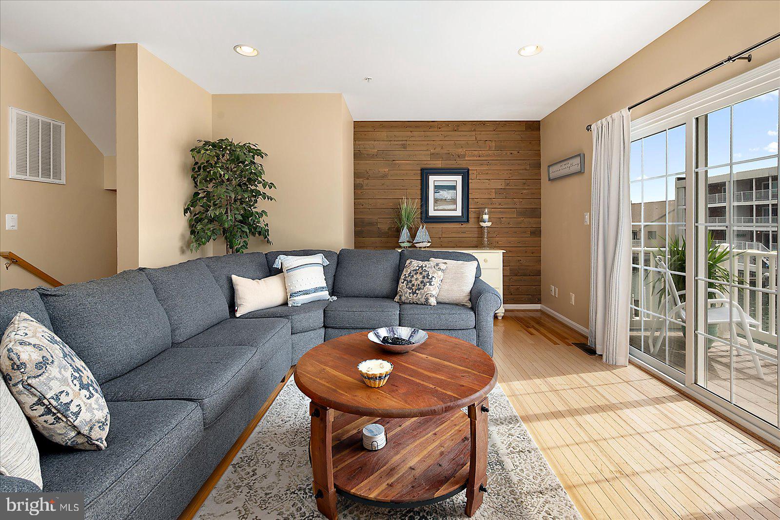 617 Salt Spray Road, Unit D Ocean City, MD 21842 - Photo 5 of 69 a living room with furniture and a rug
