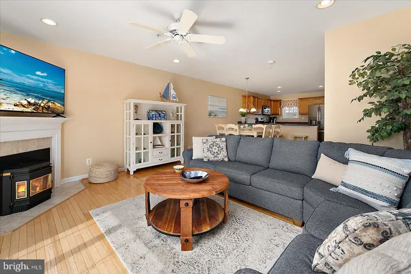 a living room with furniture fireplace and a flat screen tv
