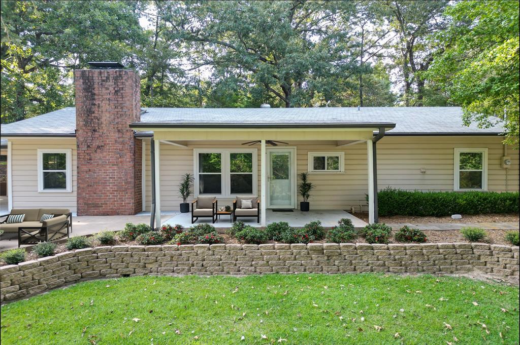 998 County Road 3230 Quitman, TX 75783 - Photo 2 of 24 a front view of a house with a yard garden and outdoor seating