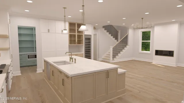 a room with a sink and a stove