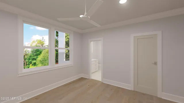 an empty room with windows and closet