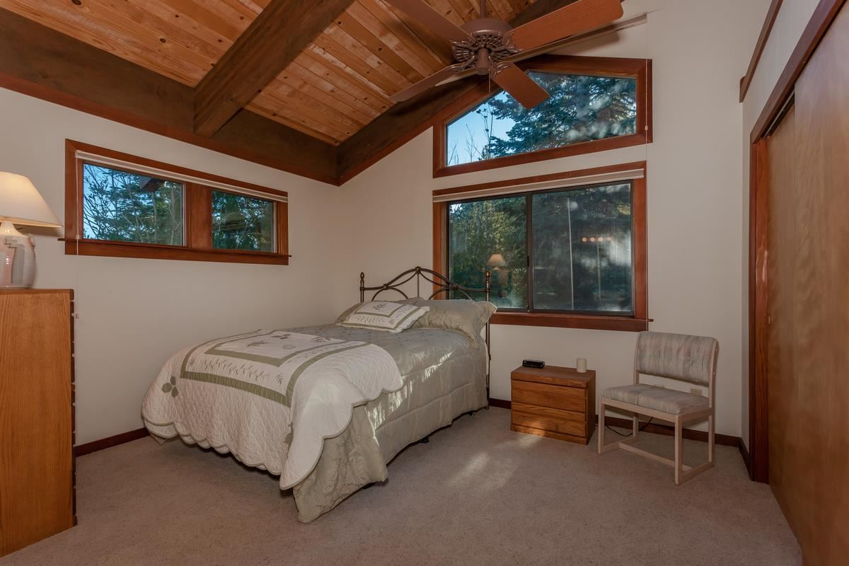 1311 Pine Trail Alpine Meadows, CA 96146 - Photo 11 of 14 a bedroom with a bed and a window
