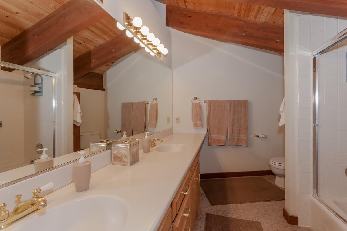 1311 Pine Trail Alpine Meadows, CA 96146 - Photo 9 of 14 a bathroom with a sink and a mirror