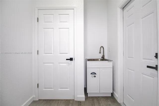 a bathroom with a sink and mirror