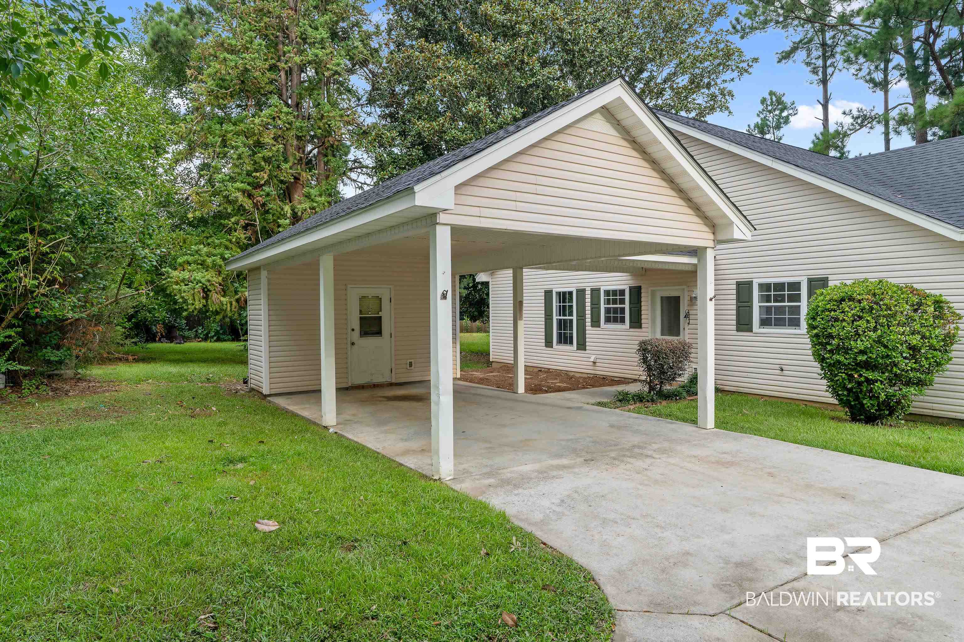 20525 Lawrence Road Fairhope, AL 36532 - Photo 25 of 26 View of front of home with a carport and a front yard