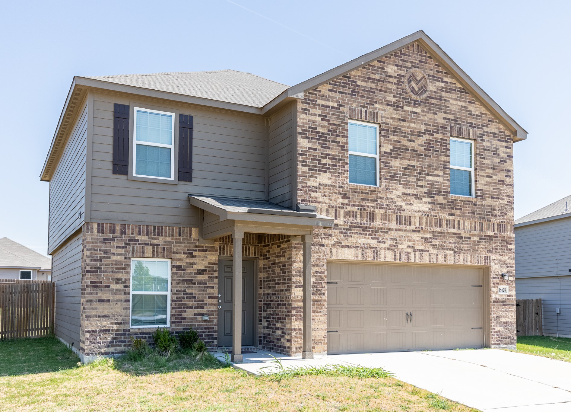 18628 Quiet Range Drive Elgin, TX 78621 - Photo 2 of 32 a front view of a house with a yard