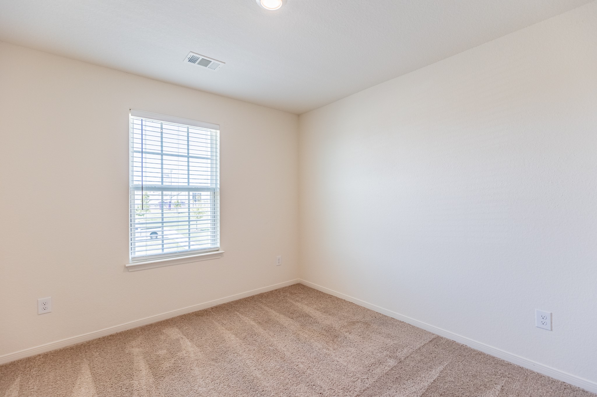 18628 Quiet Range Drive Elgin, TX 78621 - Photo 20 of 32 an empty room with a window