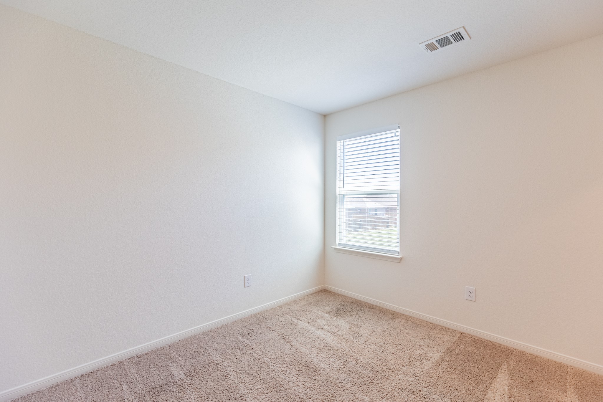 18628 Quiet Range Drive Elgin, TX 78621 - Photo 24 of 32 an empty room with windows