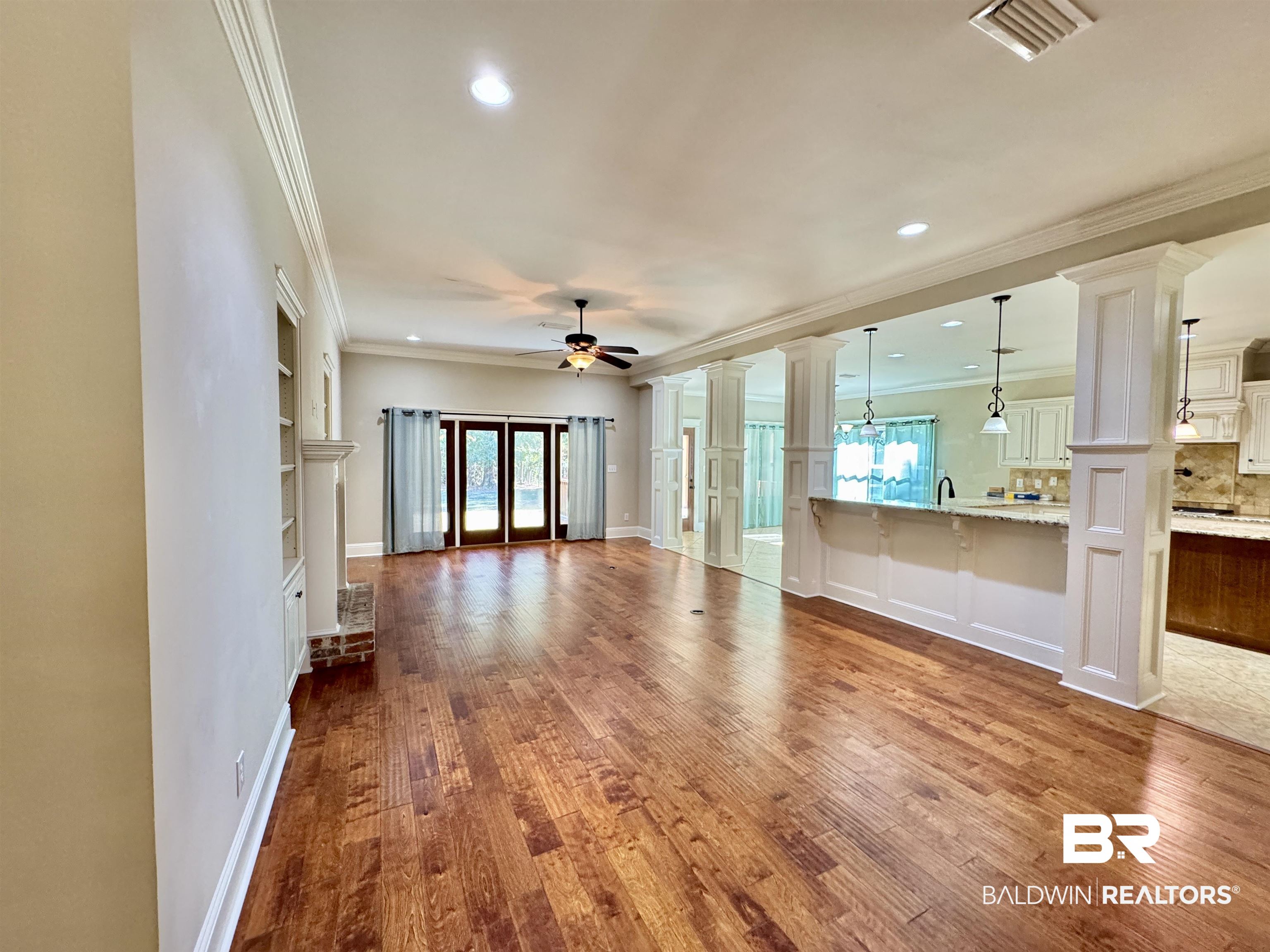 10846 County Road 138 Bay Minette, AL 36507 - Photo 16 of 53 Unfurnished living room with ornamental molding, hardwood / wood-style floors, and ceiling fan