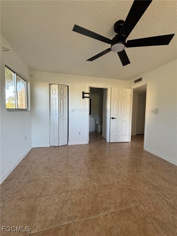 5713 Foxlake Drive, Unit 1 North Fort Myers, FL 33917 - Photo 8 of 10 a view of a livingroom with a ceiling fan and window
