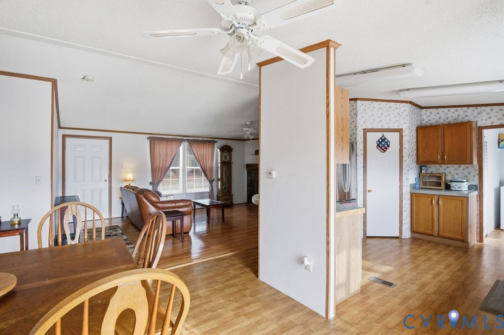 25825 Ridge Lane McKenney, VA 23872 - Photo 12 of 48 a view of a dining room with furniture window and wooden floor