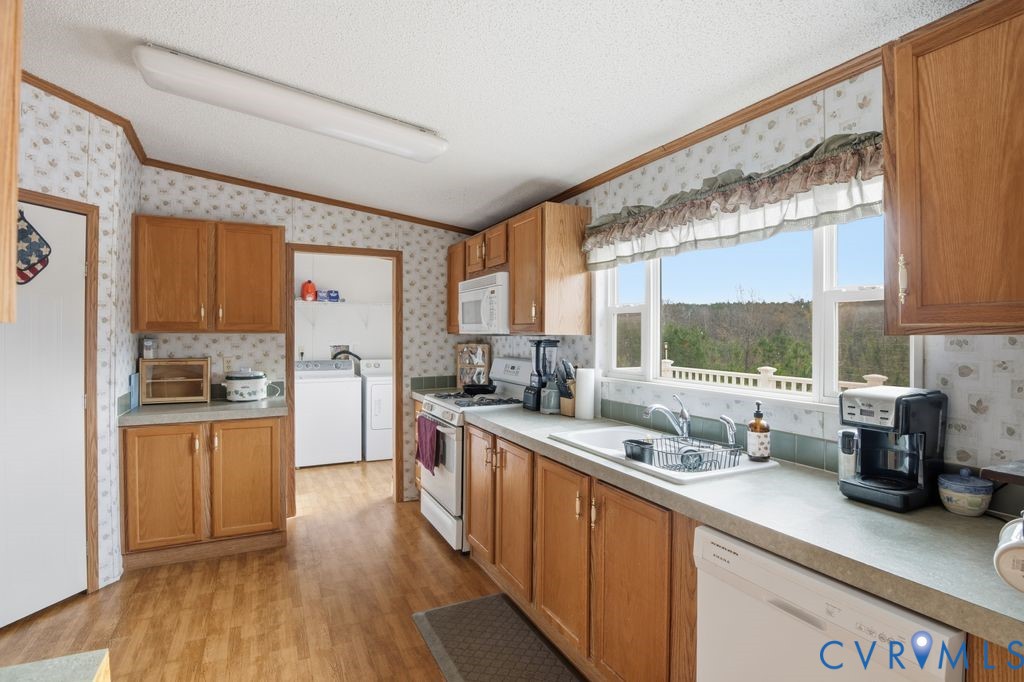 25825 Ridge Lane McKenney, VA 23872 - Photo 13 of 48 a kitchen with stainless steel appliances a sink window and cabinets