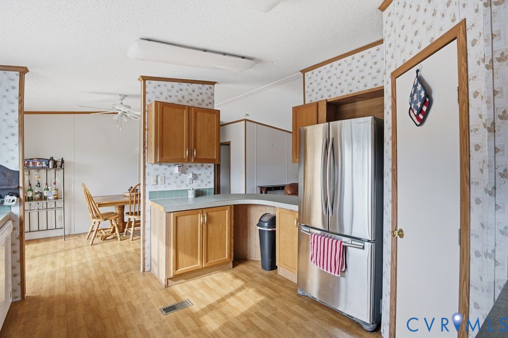 25825 Ridge Lane McKenney, VA 23872 - Photo 14 of 48 a kitchen with stainless steel appliances granite countertop a refrigerator and a stove top oven