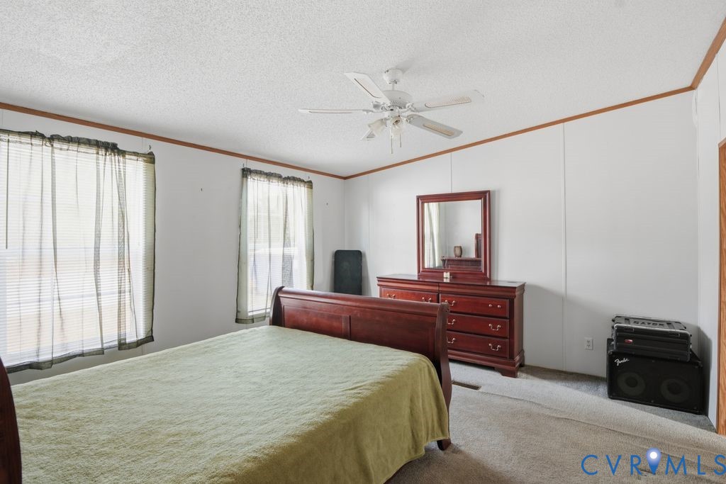 25825 Ridge Lane McKenney, VA 23872 - Photo 21 of 48 a bed room with a bed and a television