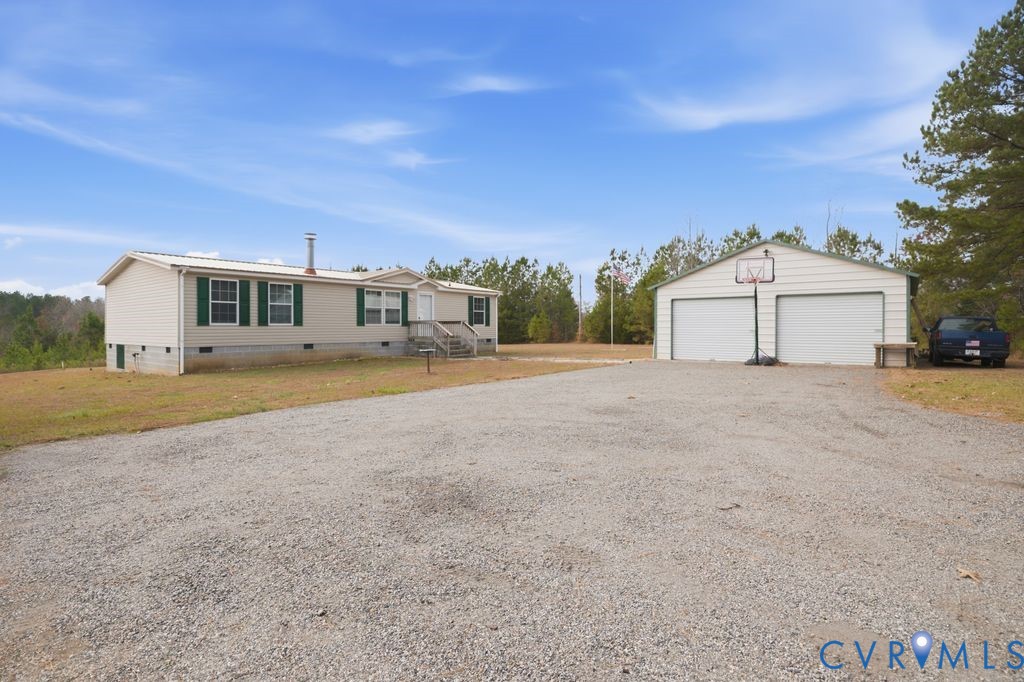 25825 Ridge Lane McKenney, VA 23872 - Photo 38 of 48 a view of a house with a big yard and large trees