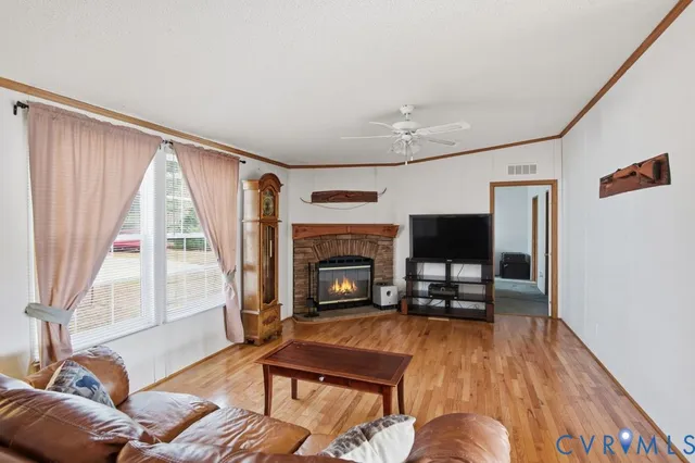 a living room with furniture fireplace and flat screen tv