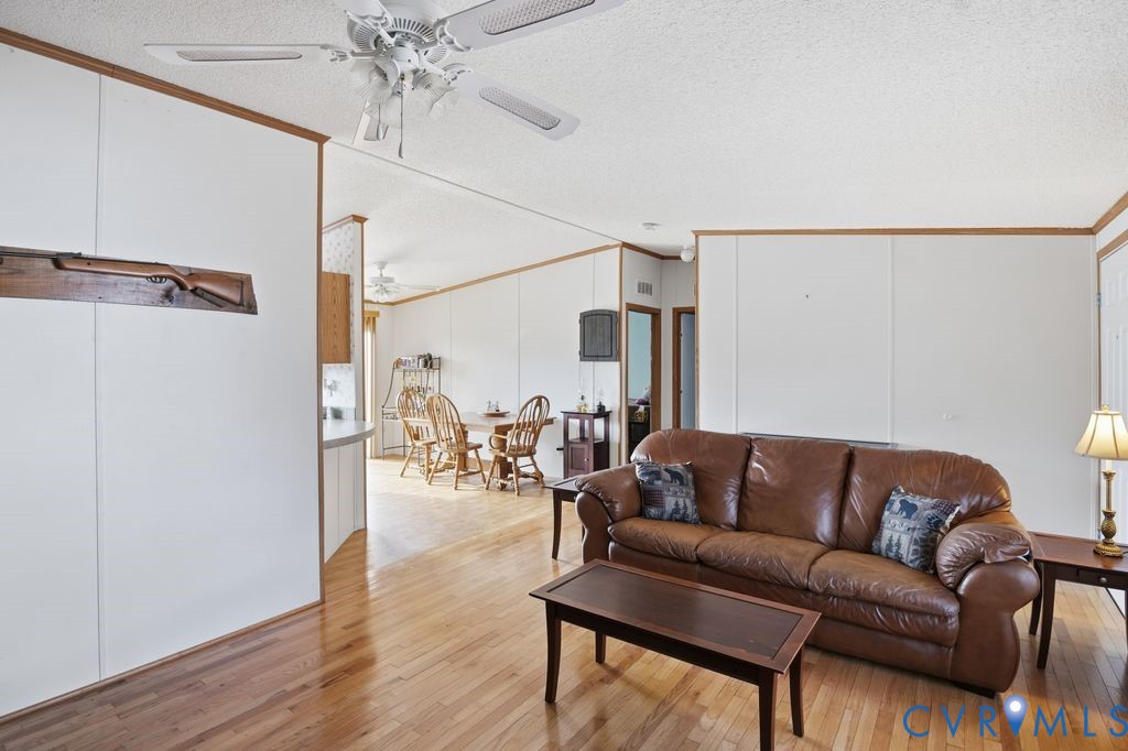 25825 Ridge Lane McKenney, VA 23872 - Photo 10 of 48 a living room with furniture and a chandelier