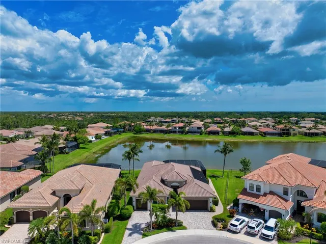 an aerial view of lake residential house with outdoor space and seating