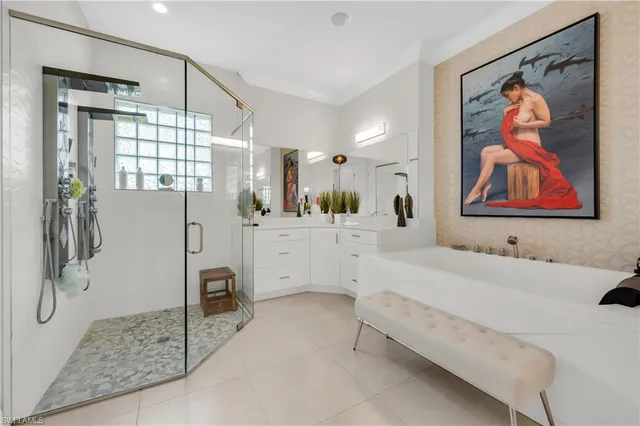 a bathroom with a double vanity sink mirror and shower
