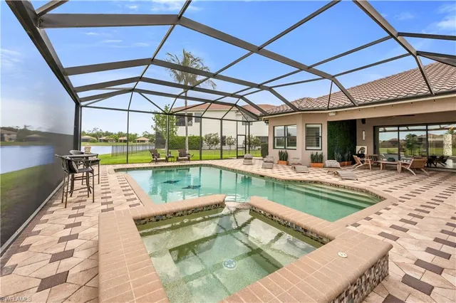 a view of a swimming pool with a patio