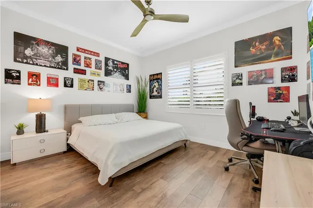 a bedroom with a bed and a desk