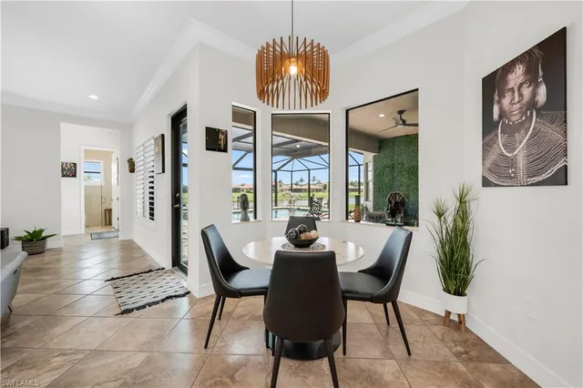 a dining room with furniture and window