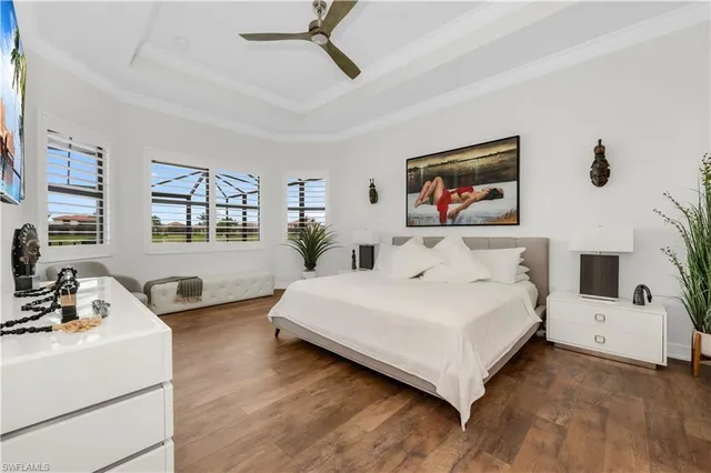 a bedroom with a bed a couch and a window