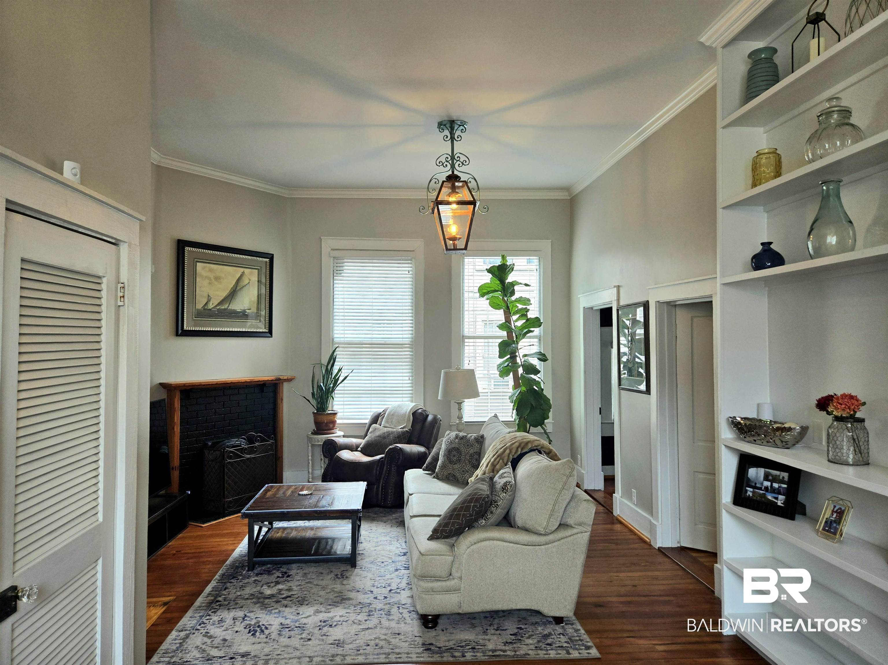 54 South Catherine Street Mobile, AL 36604 - Photo 14 of 55 Living area featuring dark wood-style flooring and crown molding