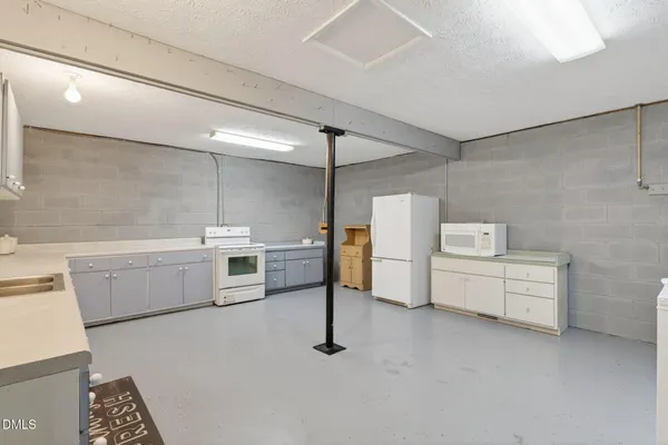 a view of a bedroom with wooden floor