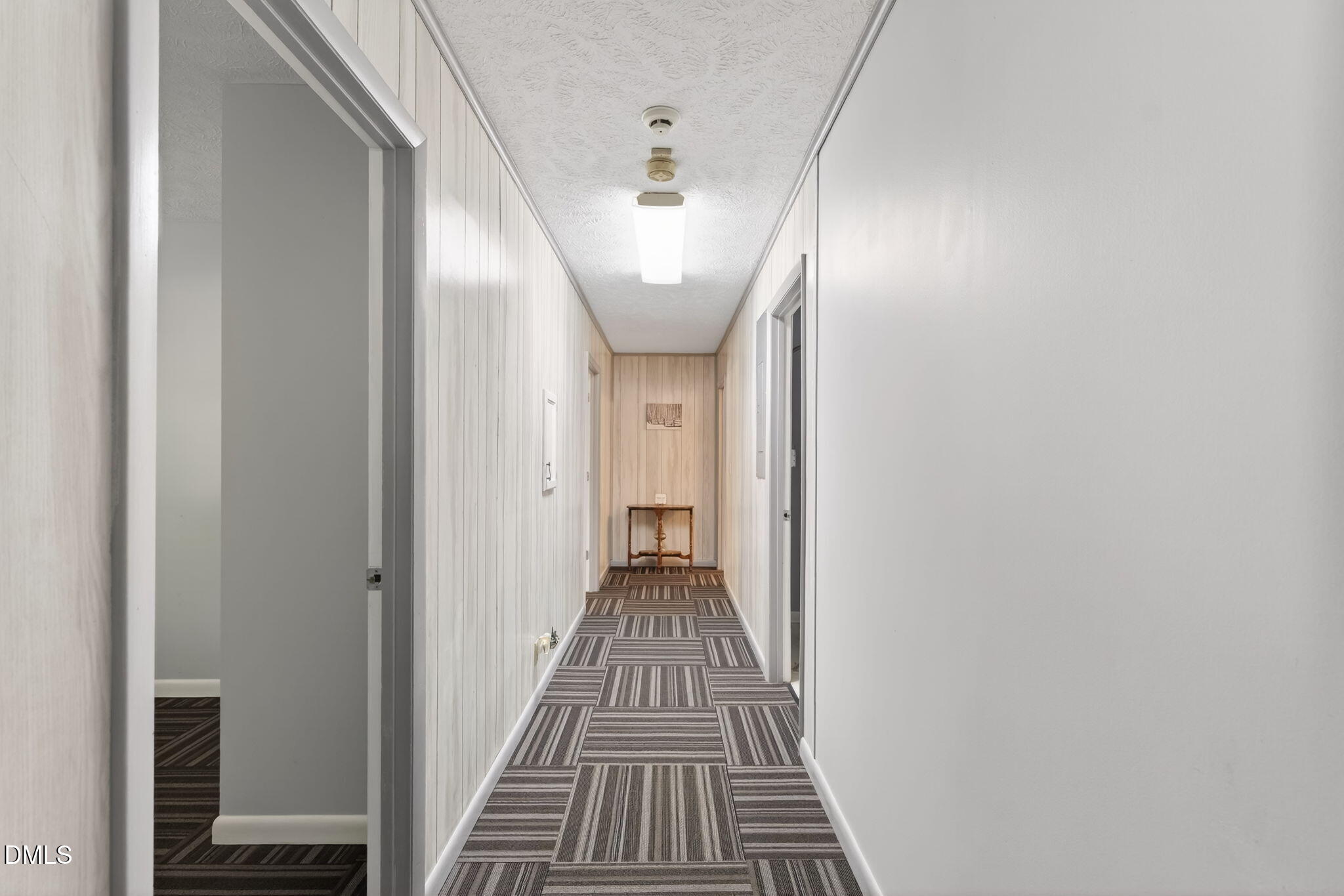 5363 Scottie Godwin Road Wade, NC 28395 - Photo 16 of 87 a view of a hallway view with wooden floor and staircase