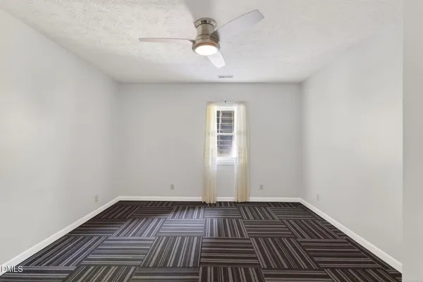 a view of a bathroom from a hallway