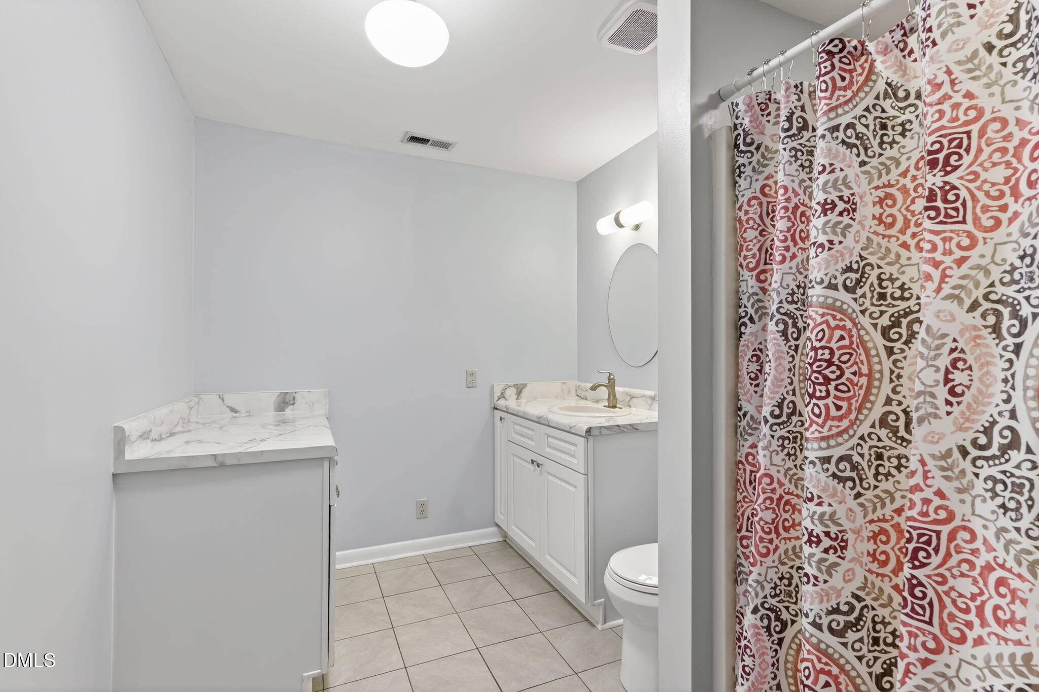 5363 Scottie Godwin Road Wade, NC 28395 - Photo 22 of 87 a bathroom with a sink toilet and shower