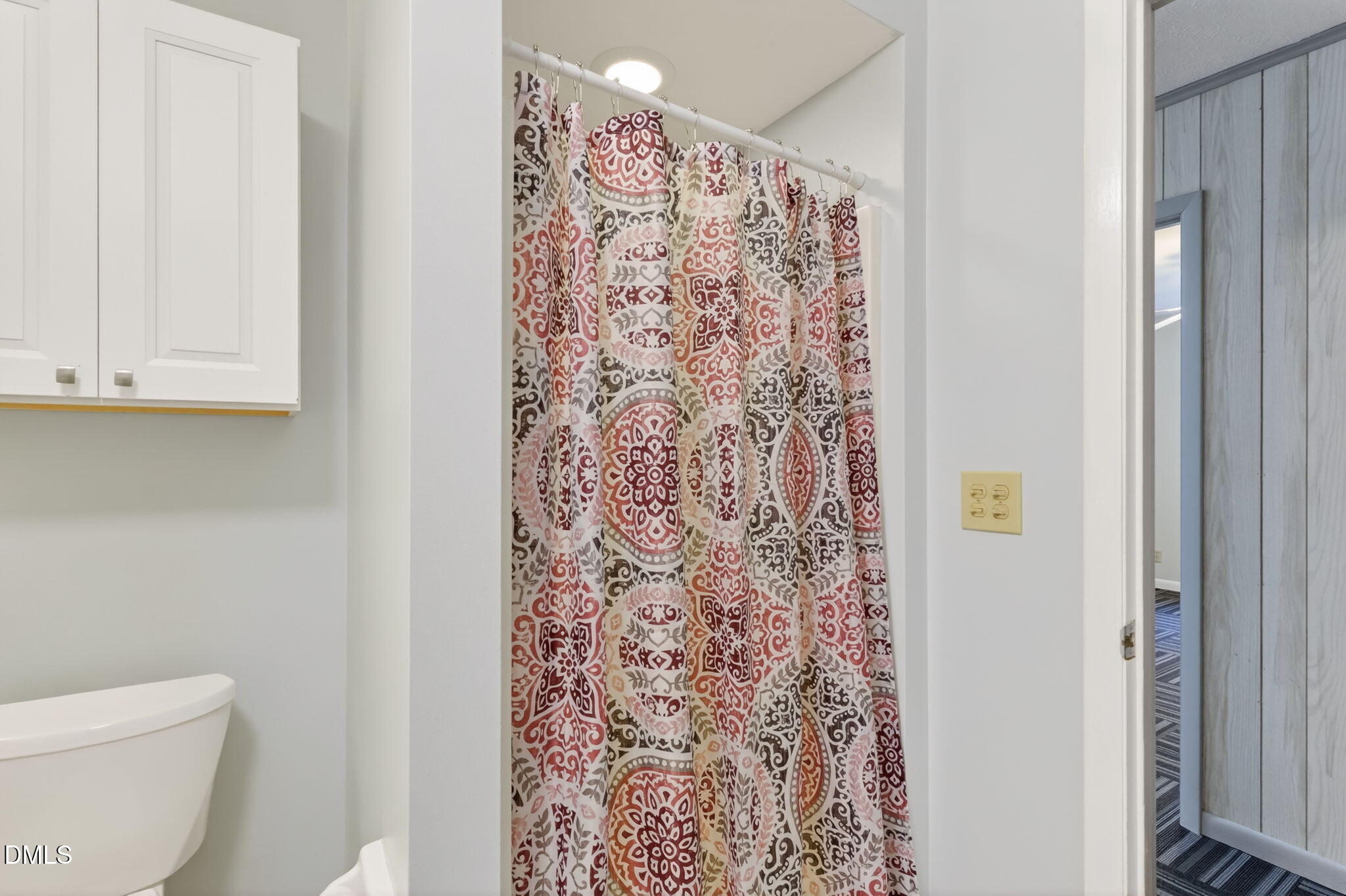 5363 Scottie Godwin Road Wade, NC 28395 - Photo 24 of 87 a bathroom with a toilet and a shower curtain
