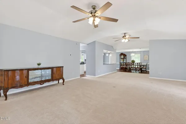 a spacious bedroom with a bed and a window