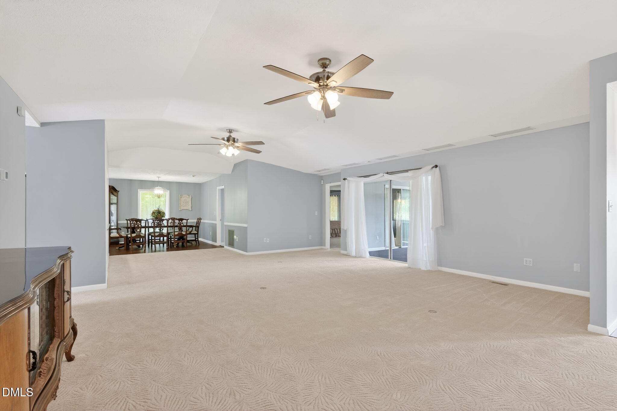 5363 Scottie Godwin Road Wade, NC 28395 - Photo 31 of 87 a view of a livingroom with a ceiling fan and window