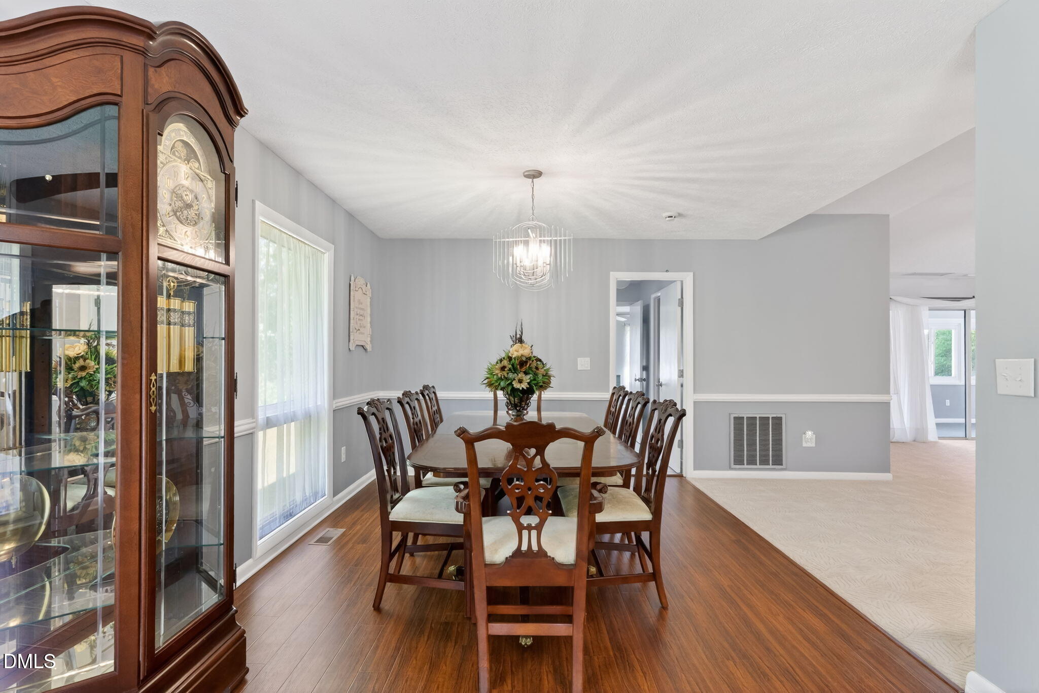 5363 Scottie Godwin Road Wade, NC 28395 - Photo 38 of 87 a view of a dining room with furniture and wooden floor