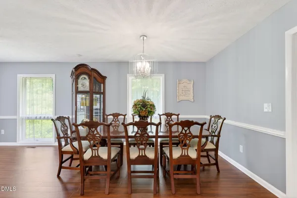 an empty room with a window and a ceiling fan