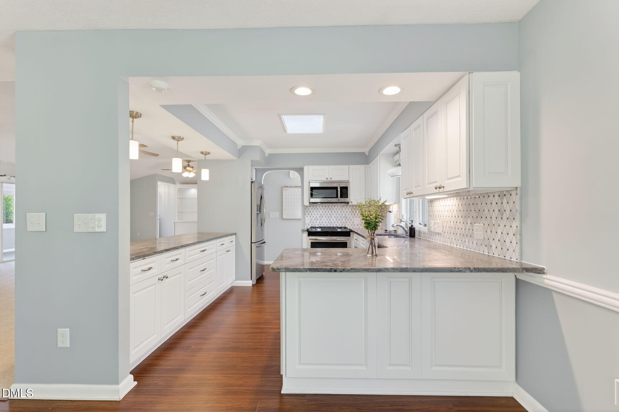 5363 Scottie Godwin Road Wade, NC 28395 - Photo 42 of 87 a large white kitchen with a large window